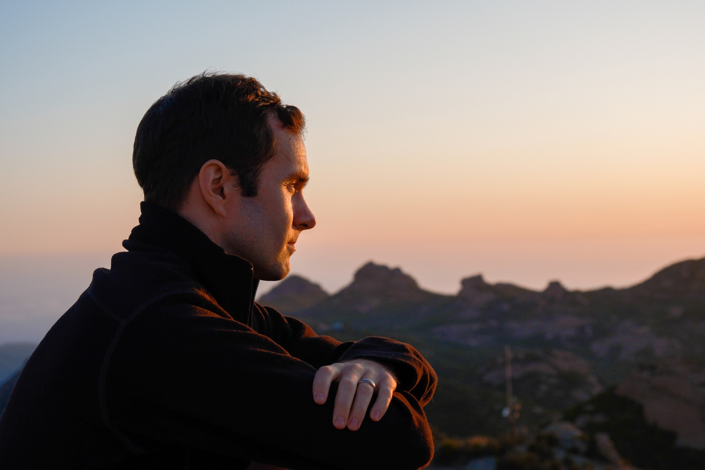 Garrett John Law at a ridgeline overlook at sunset